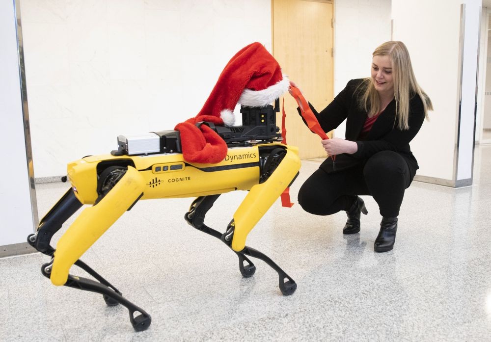 Oslo: Norway's Minister of Petroleum and Energy, Tina Bru poses with robot dog "Spot" decorated for Christmas, during a press conference in Oslo, Tuesday Dec. 8, 2020.  The robot dog is developed by Boston Dynamics for BP petroleum company to carry out tasks such as inspection and maintenance work on drill platforms in The North Sea.AP/PTI